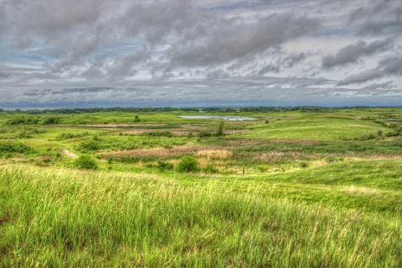 A little HDR action to enhance the drama of thunderstorms over a prairie landscape.